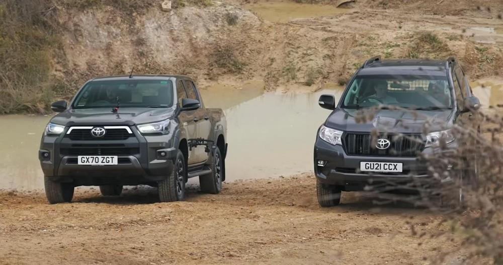 toyota hilux takes on a land cruiser in an uphill af26